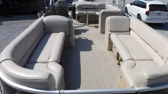 Slide: The Image of Interior of a 2018 Tahoe LTZ Cruise 24' pontoon boat with beige seating. - 7