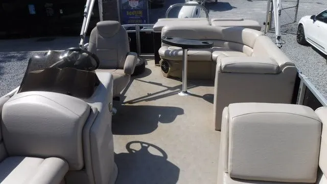 Slide: The Image of Interior of a 2018 Tahoe LTZ Cruise 24' pontoon boat with beige seating. - 8