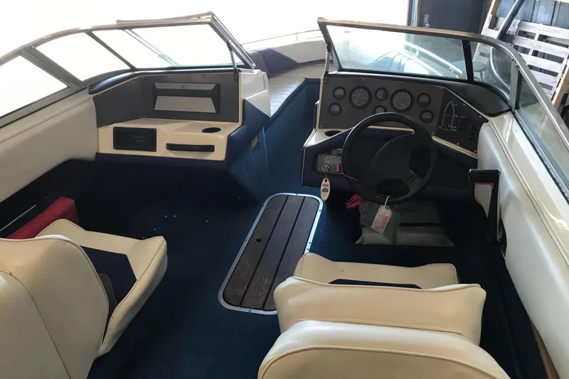 Slide: The Image of 1992 Seaswirl 190 Bowrider I/O interior with steering wheel and seating. - 10