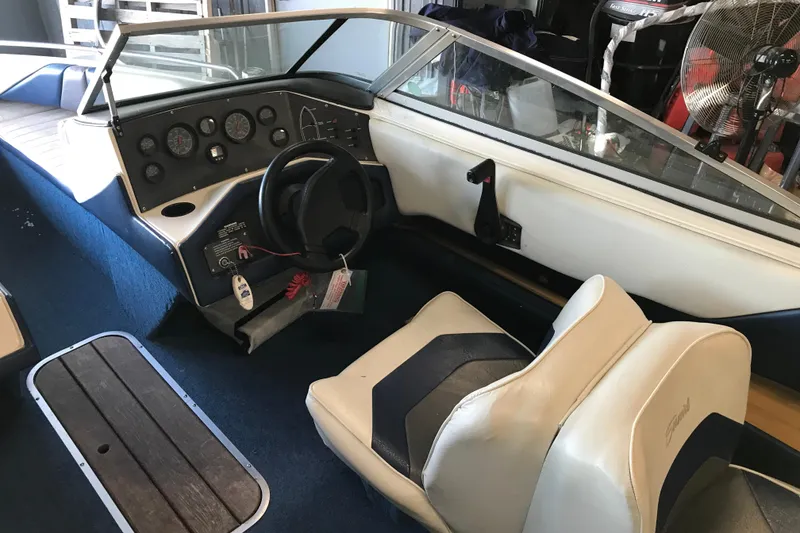 Slide: The Image of 1992 Seaswirl 190 Bowrider I/O interior with steering wheel and dashboard controls. - 13