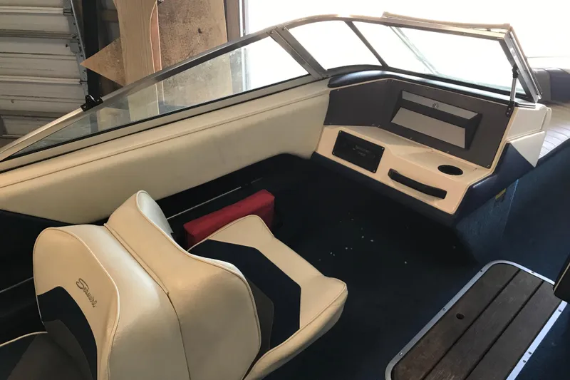 Slide: The Image of Interior of a 1992 Seaswirl 190 Bowrider I/O boat with seating and dashboard. - 14