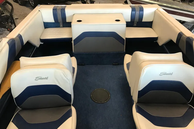 Slide: The Image of Interior of a 1992 Seaswirl 190 Bowrider I/O boat with blue and white seating. - 20