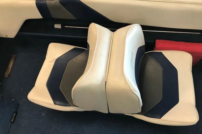 Slide: The Image of 1992 Seaswirl 190 Bowrider I/O boat seats with blue and white upholstery. - 21