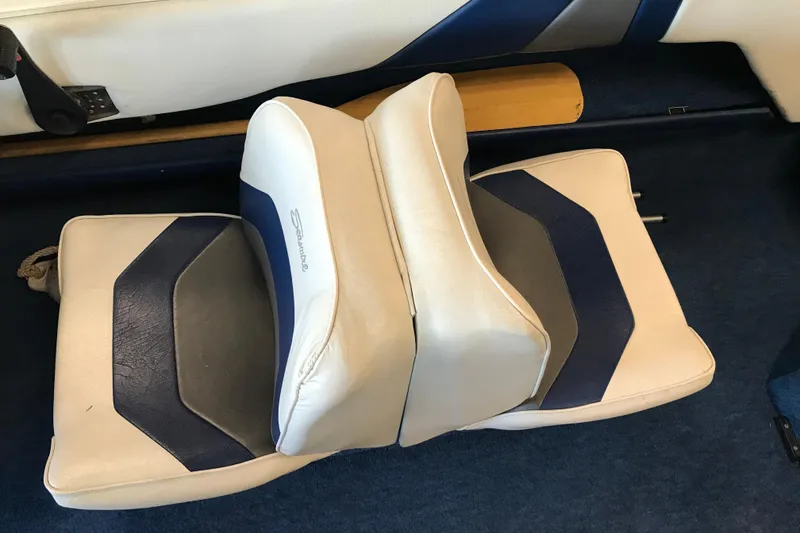 Slide: The Image of 1992 Seaswirl 190 Bowrider I/O boat seats with blue and white upholstery. - 22