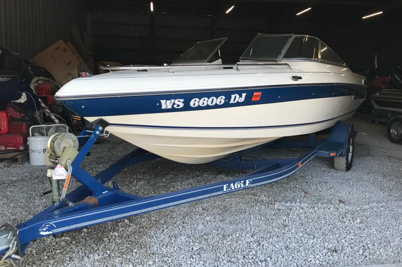 Slide: The Image of 1992 Seaswirl 190 Bowrider I/O boat on trailer in storage shed. - 3