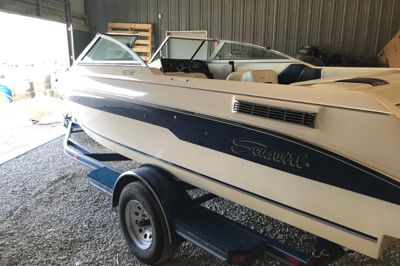 Slide: The Image of 1992 Seaswirl 190 Bowrider I/O boat on trailer in storage facility. - 4