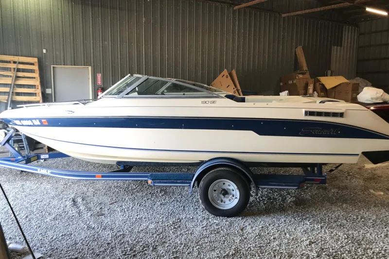 Slide: The Image of 1992 Seaswirl 190 Bowrider I/O boat on trailer in storage facility. - 5