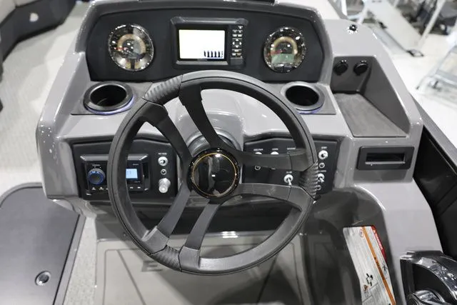 Slide: The Image of Evotti 521 CS 2026 boat dashboard with modern steering wheel and controls. - 16