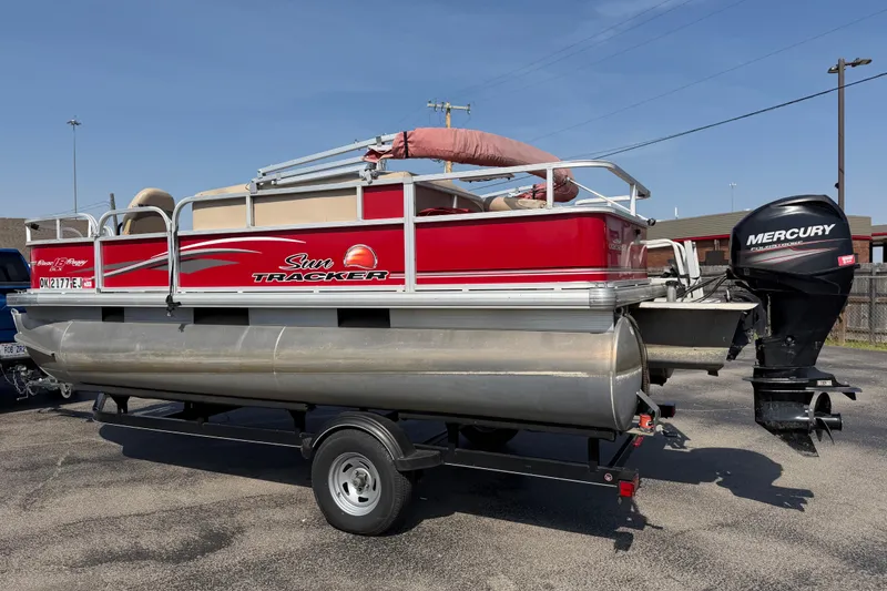 Slide: The Image of 2016 Sun Tracker Bass Buggy 18 DLX pontoon boat with Mercury outboard motor. - 3