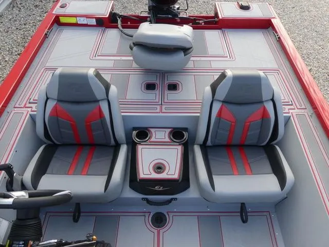Slide: The Image of Interior of 2026 G3 Sportsman 1710 SE with gray and red seats. - 12