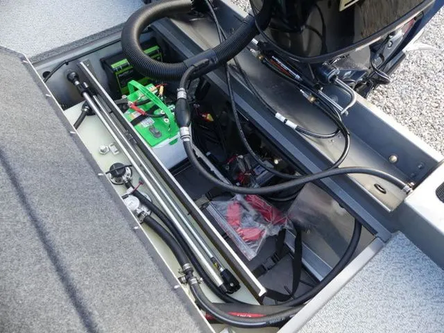 Slide: The Image of Interior view of G3 Sportsman 1810 PFX 2026 with battery and cables. - 11