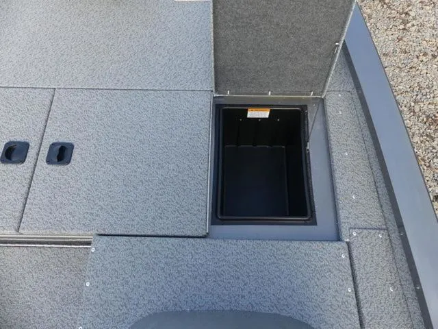 Slide: The Image of G3 Sportsman 1810 PFX 2026 boat with open storage compartment. - 17