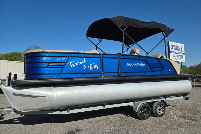 The Image of 2020 Godfrey AquaPatio 235 C pontoon boat with blue exterior on trailer. - 0