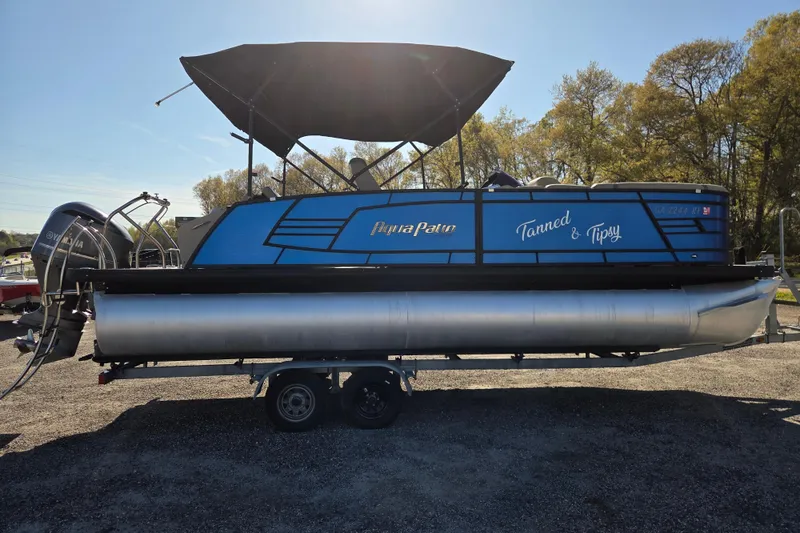 Slide: The Image of 2020 Godfrey AquaPatio 235 C pontoon boat on trailer, blue with canopy. - 3