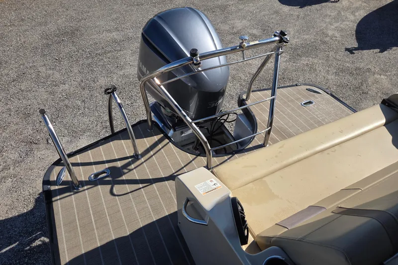 Slide: The Image of Rear view of 2020 Godfrey AquaPatio 235 C boat with motor and seating area. - 12