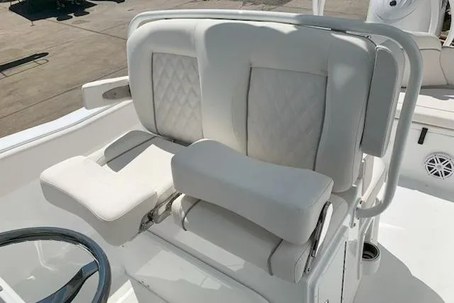 Slide: The Image of Luxurious seating on 2026 Sea Hunt Ultra 239 SE boat, featuring plush white upholstery. - 14