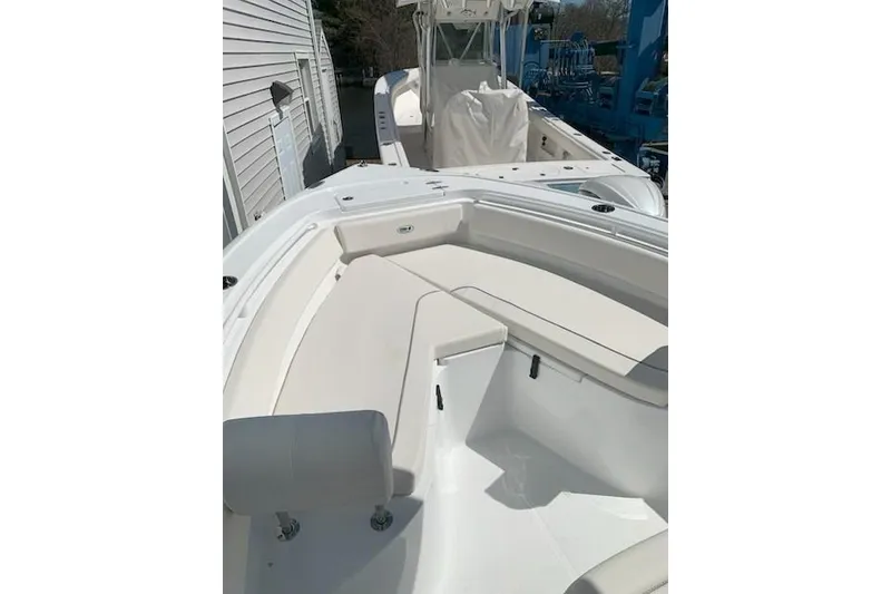 Slide: The Image of 2026 Sea Hunt Ultra 239 SE boat with spacious seating and sleek design. - 2