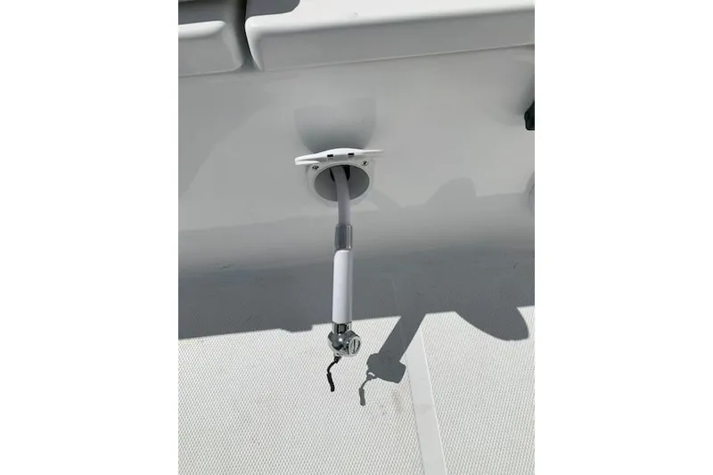 Slide: The Image of Boat deck detail of a 2026 Sea Hunt Ultra 239 SE, featuring a mounted hose connection. - 21