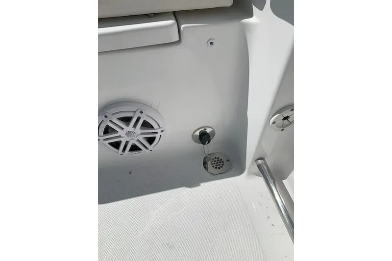 Slide: The Image of 2026 Sea Hunt Ultra 239 SE boat interior with speaker and drainage system. - 22