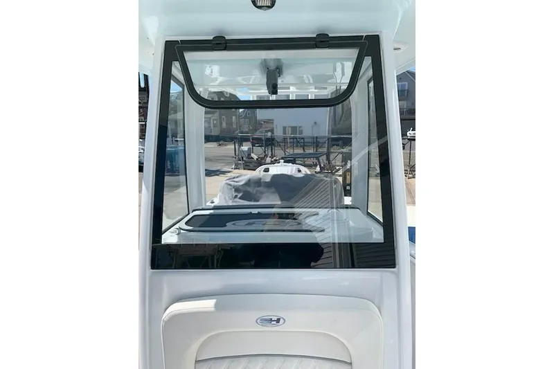 Slide: The Image of 2026 Sea Hunt Ultra 239 SE boat windshield and console view. - 3