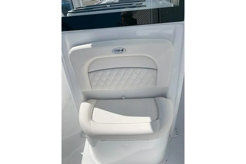 Slide: The Image of 2026 Sea Hunt Ultra 239 SE boat seat with quilted design and sleek finish. - 5