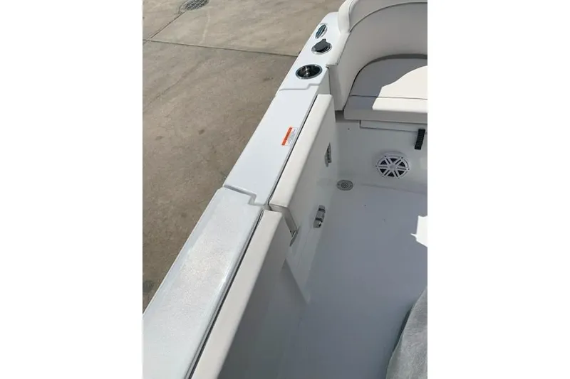 Slide: The Image of 2026 Sea Hunt Ultra 239 SE boat interior with seating and cup holders. - 6