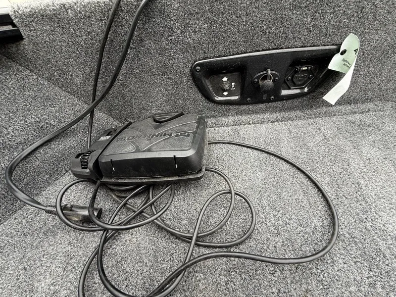 Slide: The Image of Interior of 2023 Tracker Pro Guide V-175WT with cables and controls. - 11