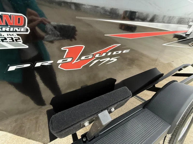 Slide: The Image of 2023 Tracker Pro Guide V-175WT boat decal on black background. - 2