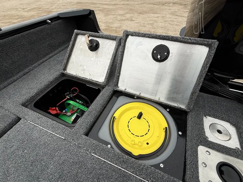 Slide: The Image of 2023 Tracker Pro Guide V-175WT boat deck with storage and battery. - 29