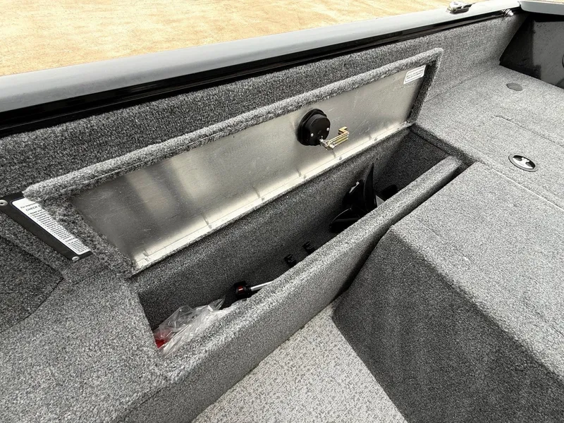 Slide: The Image of Interior view of 2023 Tracker Pro Guide V-175WT with storage compartment. - 31