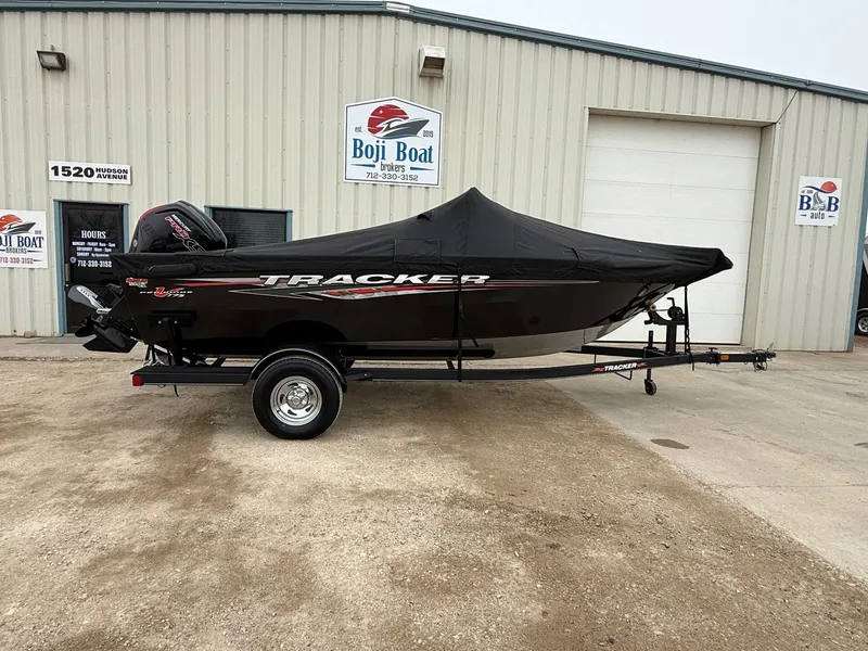 Slide: The Image of 2023 Tracker Pro Guide V-175WT boat with cover on trailer. - 34