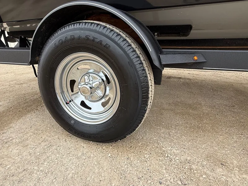 Slide: The Image of Close-up of a tire on the 2023 Tracker Pro Guide V-175WT. - 35