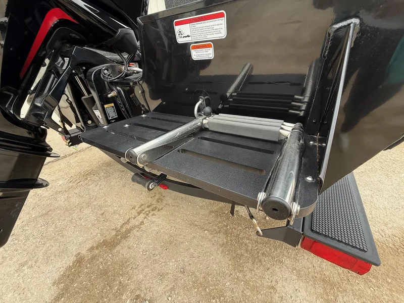 Slide: The Image of 2023 Tracker Pro Guide V-175WT boat rear with motor and platform. - 7