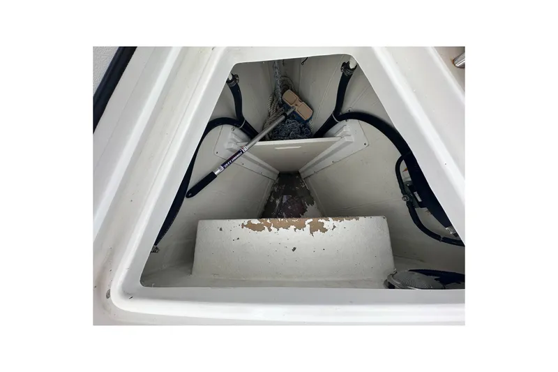Slide: The Image of Interior view of a 2016 Tartan 4000 sailboat compartment with ropes and equipment. - 11