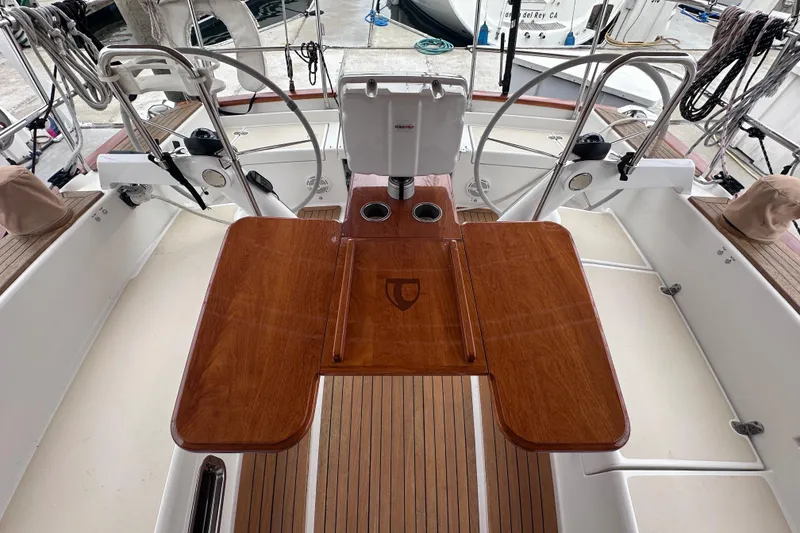 Slide: The Image of Cockpit of 2016 Tartan 4000 sailboat with wooden table and steering wheel. - 15