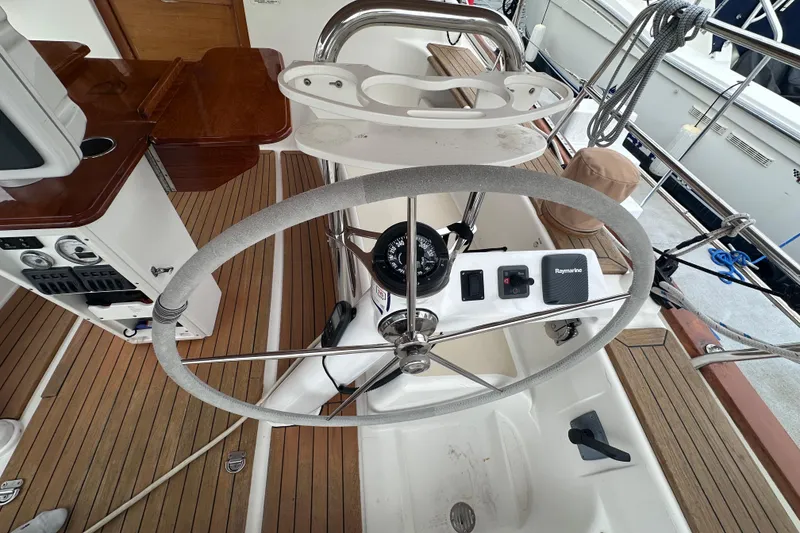 Slide: The Image of Steering wheel and controls on a 2016 Tartan 4000 sailboat deck. - 16