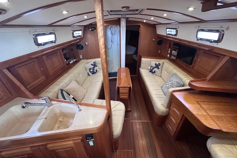 Slide: The Image of Luxurious interior of 2016 Tartan 4000 yacht with elegant wood finish and plush seating. - 17