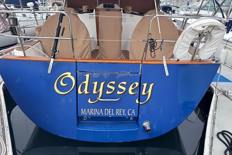 Slide: The Image of Blue Tartan 4000 sailboat named "Odyssey" docked at Marina del Rey, CA. - 27