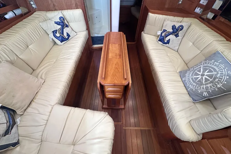 Slide: The Image of Luxurious 2016 Tartan 4000 yacht interior with beige leather seating and nautical-themed cushions. - 29