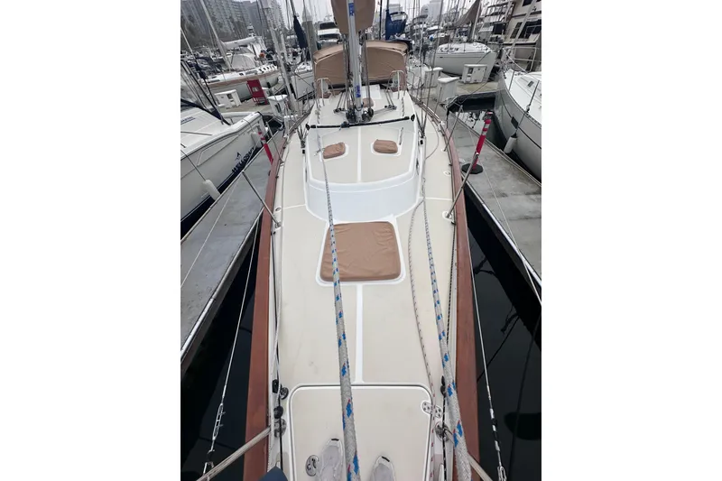 Slide: The Image of Sailboat deck view of 2016 Tartan 4000 in marina, surrounded by other boats. - 8
