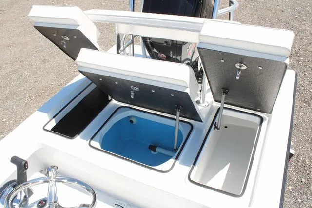 Slide: The Image of 2024 East Cape Vantage boat with open storage compartments. - 11