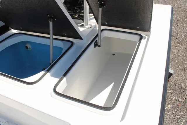 Slide: The Image of 2024 East Cape Vantage boat with open storage compartments. - 12