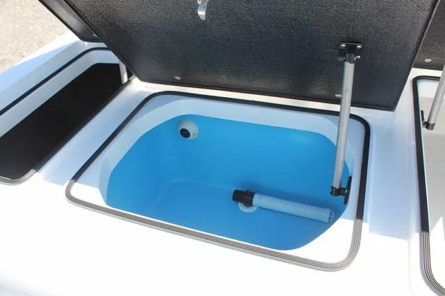 Slide: The Image of 2024 East Cape Vantage boat with open storage compartment. - 13