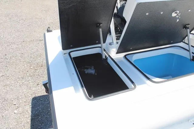 Slide: The Image of 2024 East Cape Vantage boat with open storage compartments. - 14