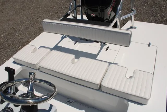 Slide: The Image of 2024 East Cape Vantage boat with white cushioned seating. - 15