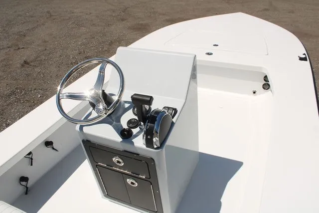 Slide: The Image of Interior view of 2024 East Cape Vantage boat, steering console and storage. - 6