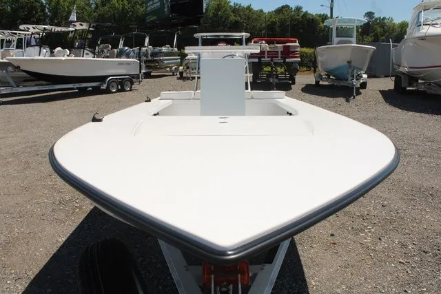 Slide: The Image of 2024 East Cape Vantage boat on a trailer outdoors. - 7