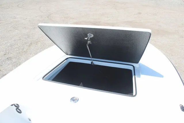 Slide: The Image of 2024 East Cape Vantage boat with open storage compartment lid. - 8