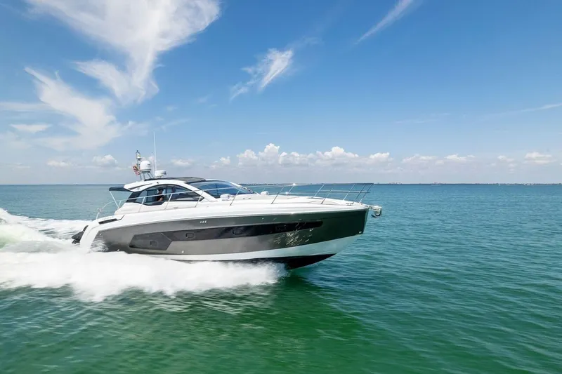 The Image of Azimut Atlantis 45 yacht cruising on open water under a clear blue sky, 2021 model. - 1
