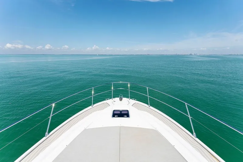 Slide: The Image of Bow view of 2021 Azimut Atlantis 45 yacht on open sea under clear blue sky. - 11